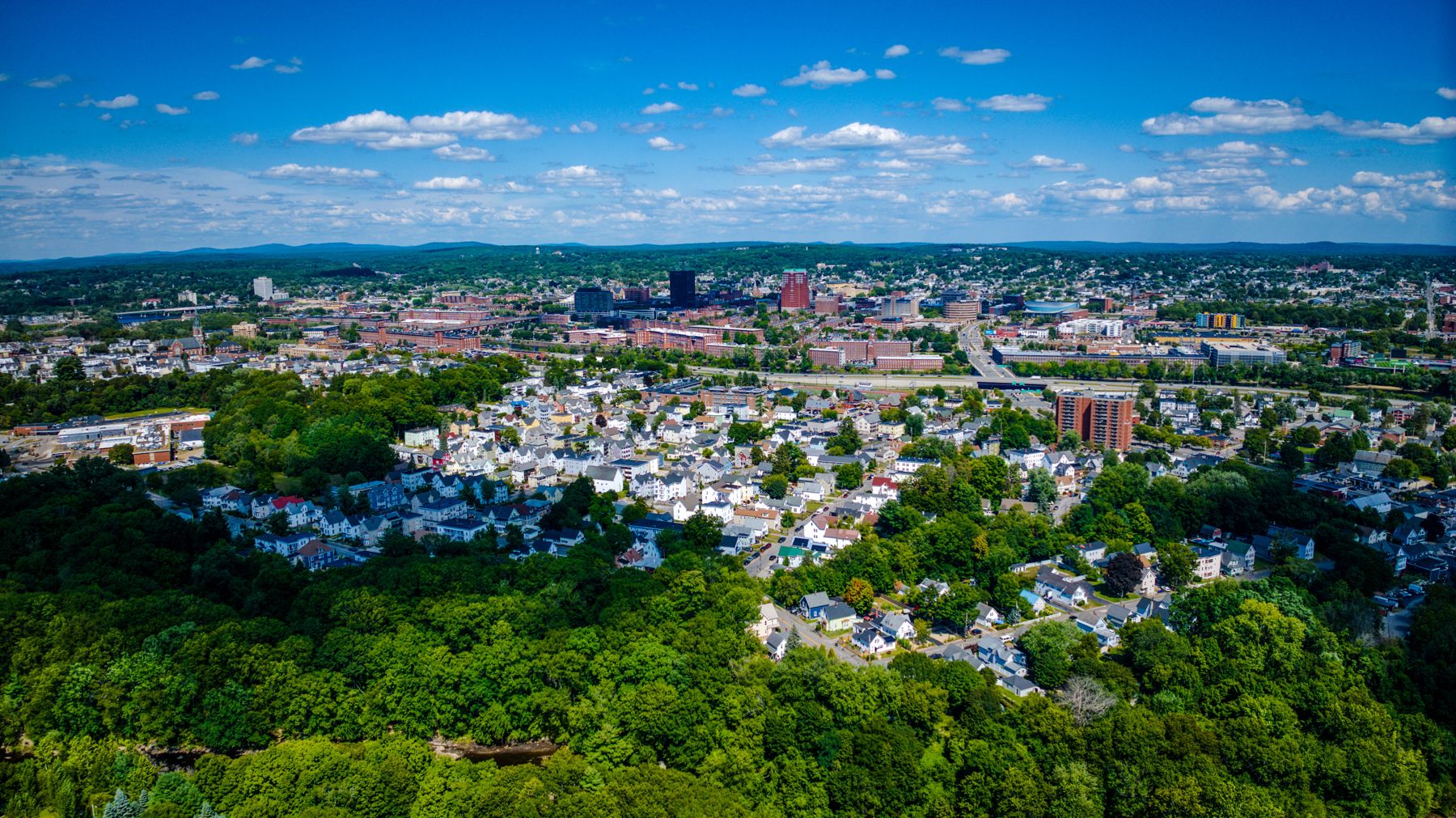 Downtown Manchester seen from above the tree line
